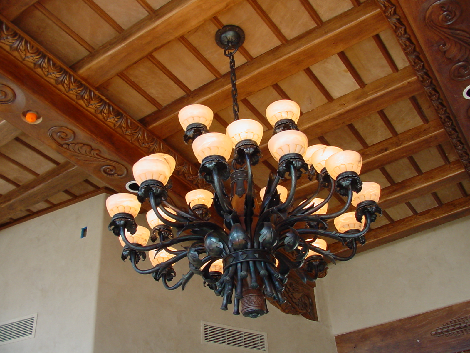 1 of 2 Room fixtures and forged for a private residence Scottsdale, AZ. By Chad and Brad Gunter. 24 arms with alabaster globes. approx 250 lbs. Design by Morelli