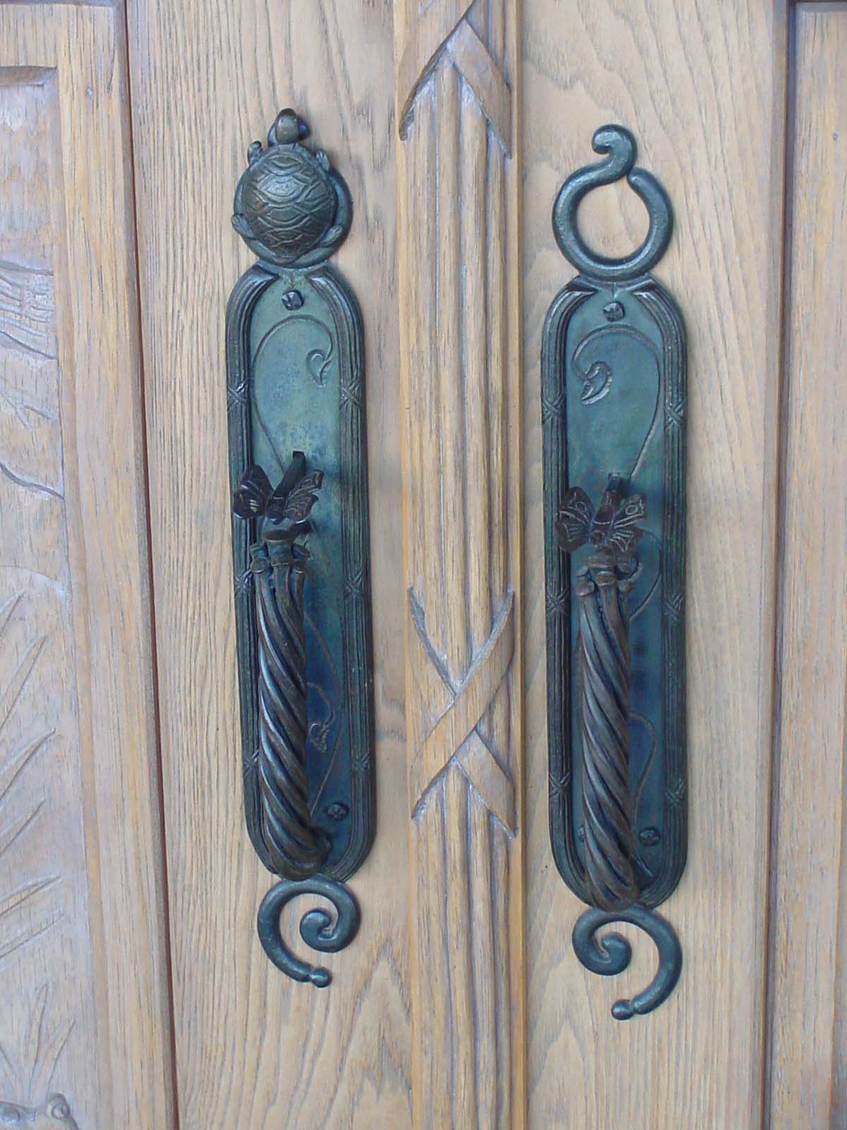 Fanciful entry door hardware. Hand forged and chased. Private residence Placitas NM.