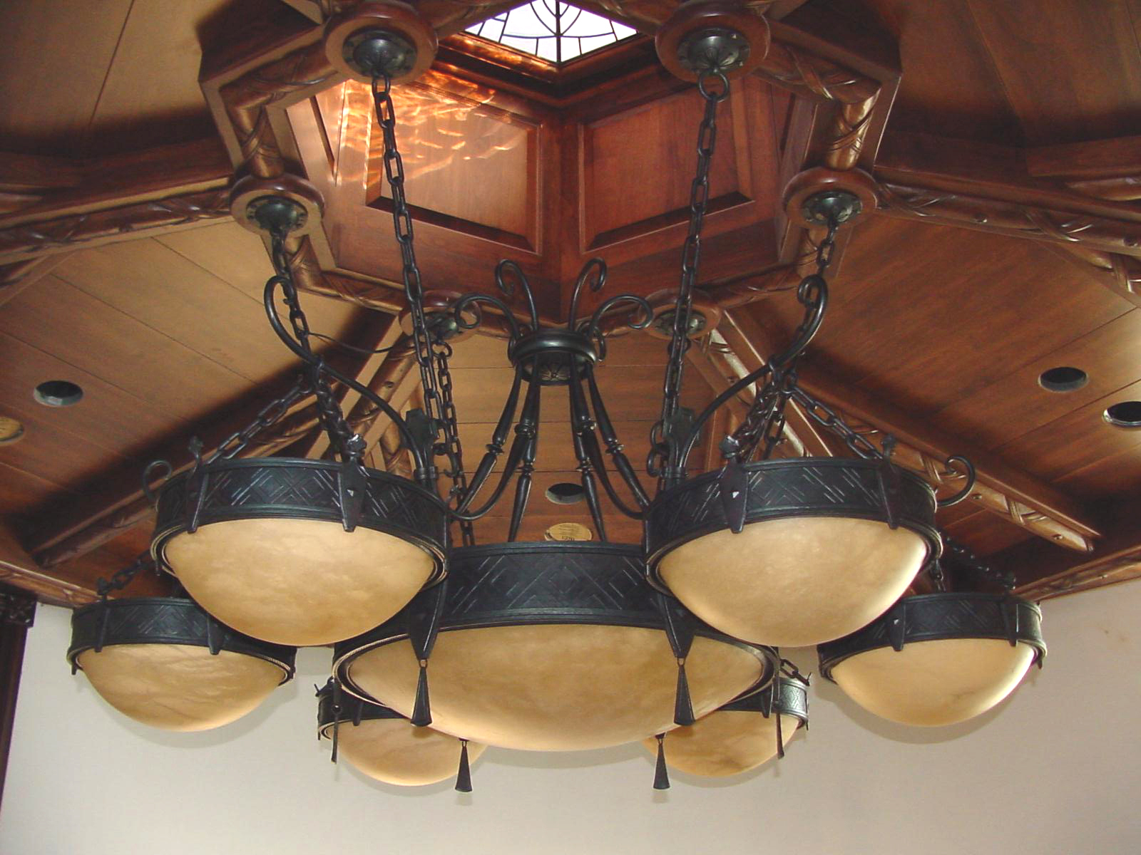 Grand Staircase Chandelier 8ft in diameter Entirely hand forged and chiseled by Chad Gunter. Alabaster bowls; aprox 350 lbs. Design by Morrelli.