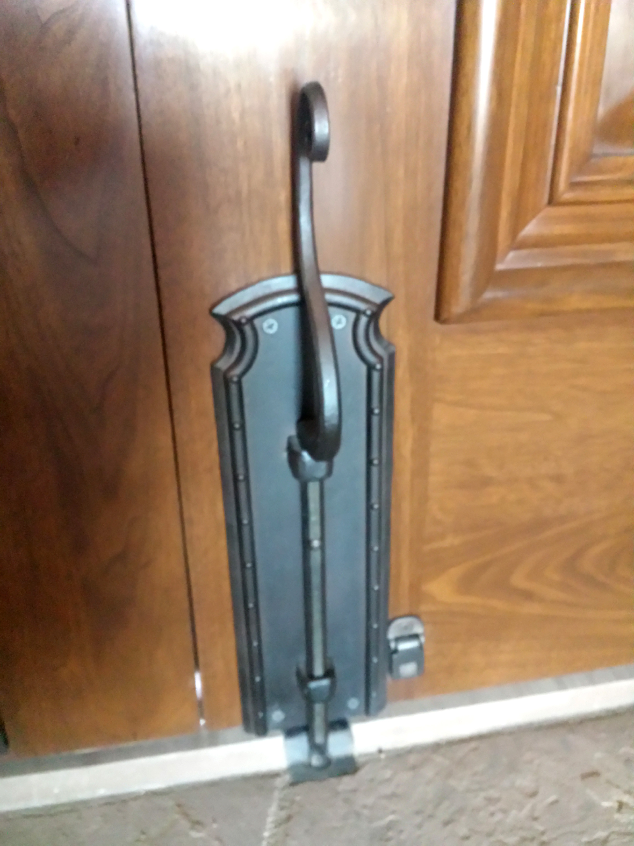 Lower cane bolt on double doors