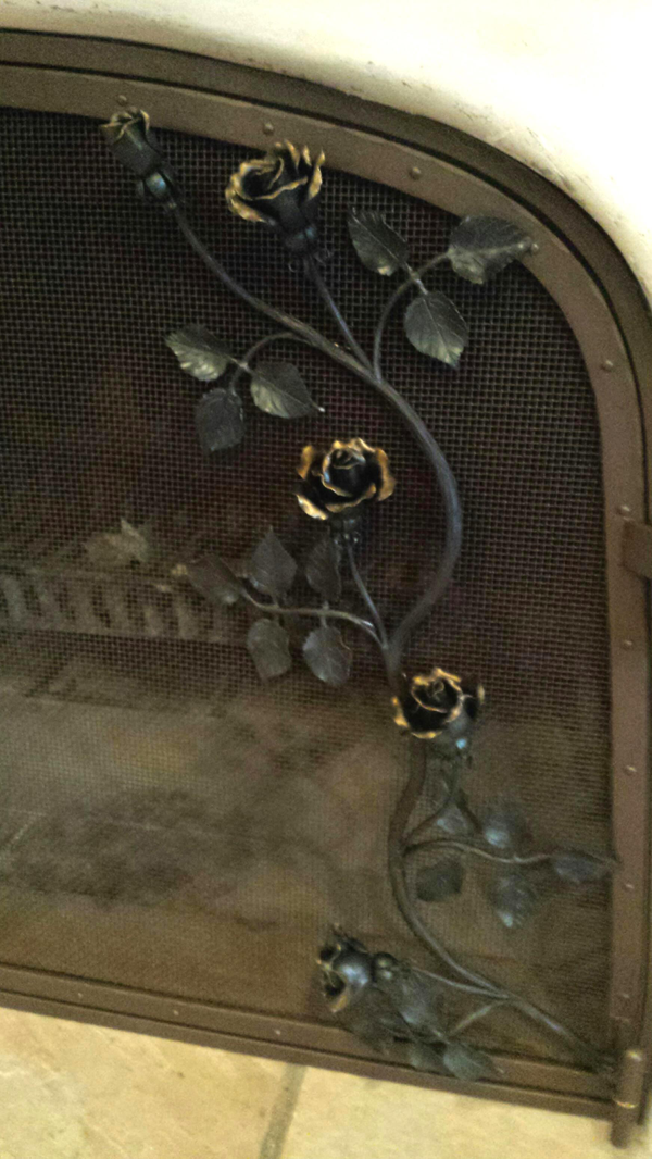 Hand forged roses on a screen door
