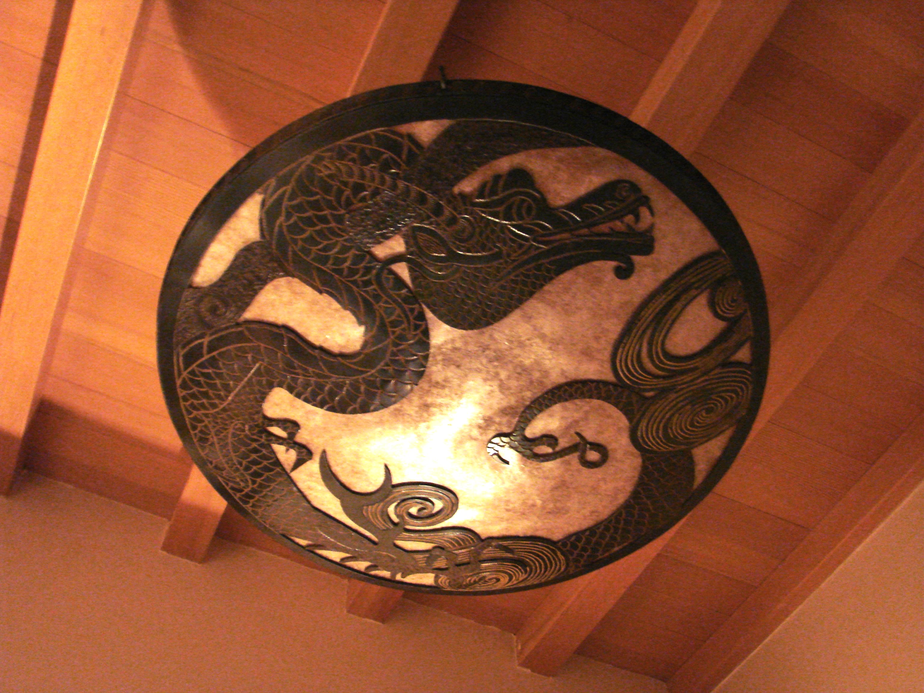 Private residence Colorado Springs 30 in diameter bowl fixture 2 of 5 Hand chiseled detail with sheet mica fill behind the dragon