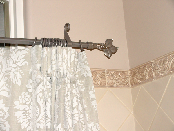 Custom curtain rod with leaf detail from the tile, powder coated finish